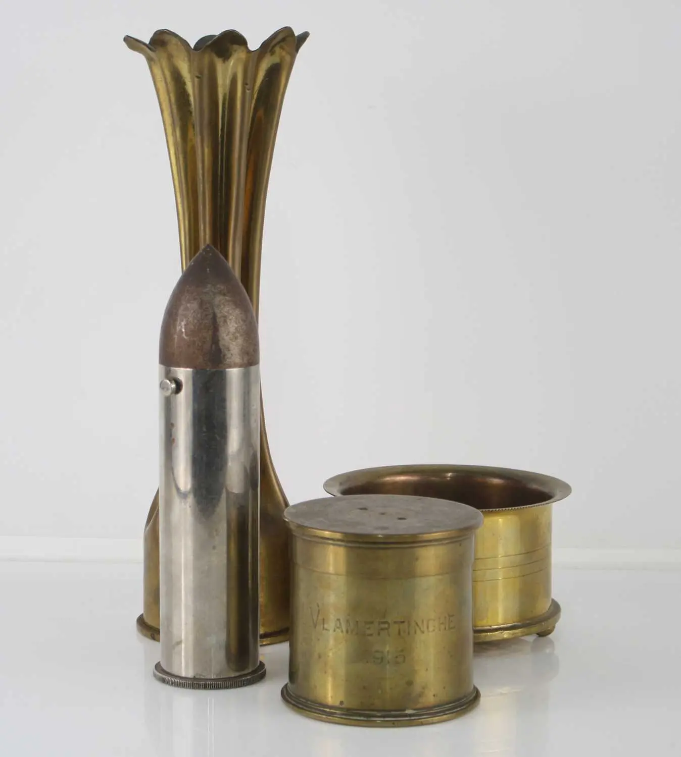 Lot 1096 - A table lighter in the form of a projectile
