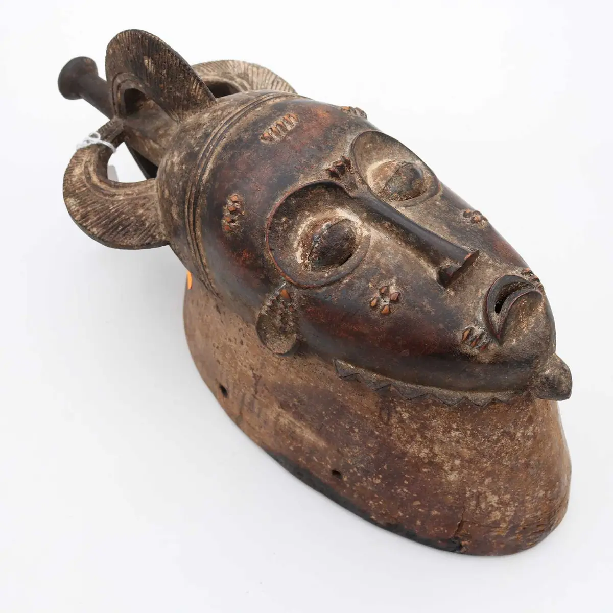 Lot 25 - A West African carved hardwood ritual mask