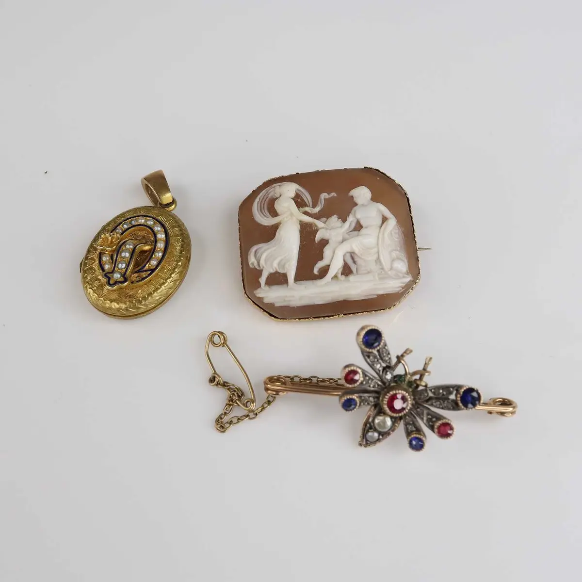 Lot 239 - A circa 1900 yellow metal sapphire, ruby and