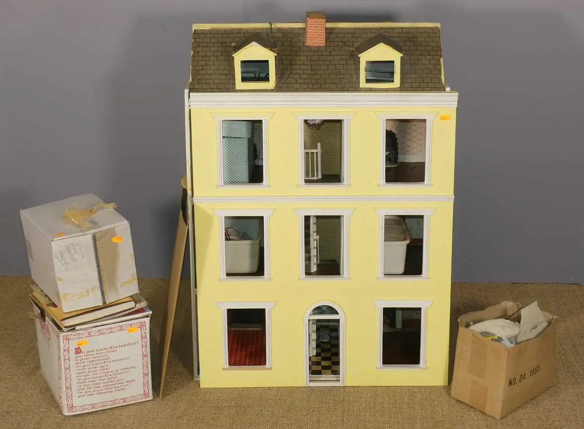Lot 628 - A contemporary painted three-storey dolls