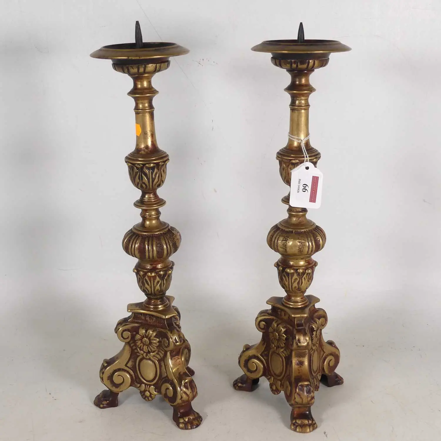 Lot 66 - A pair of cast brass pricket table