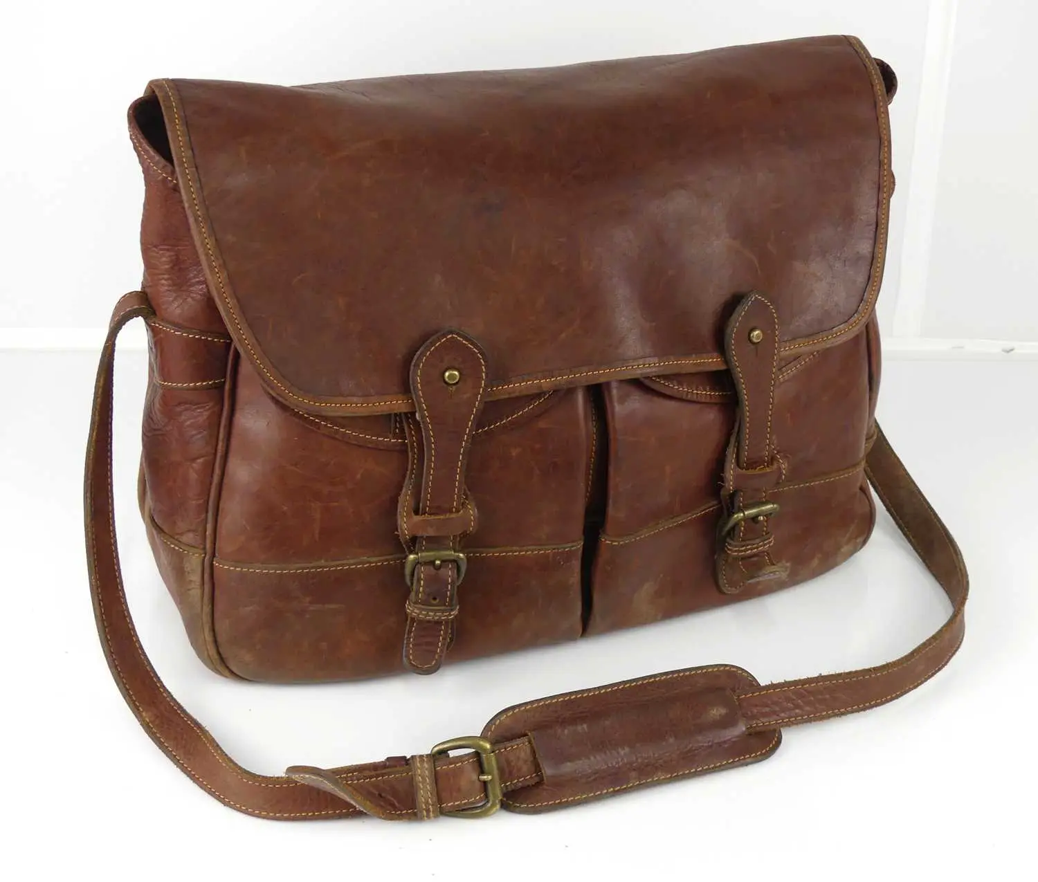 Lot 1302 - A hand stitched brown leather game bag