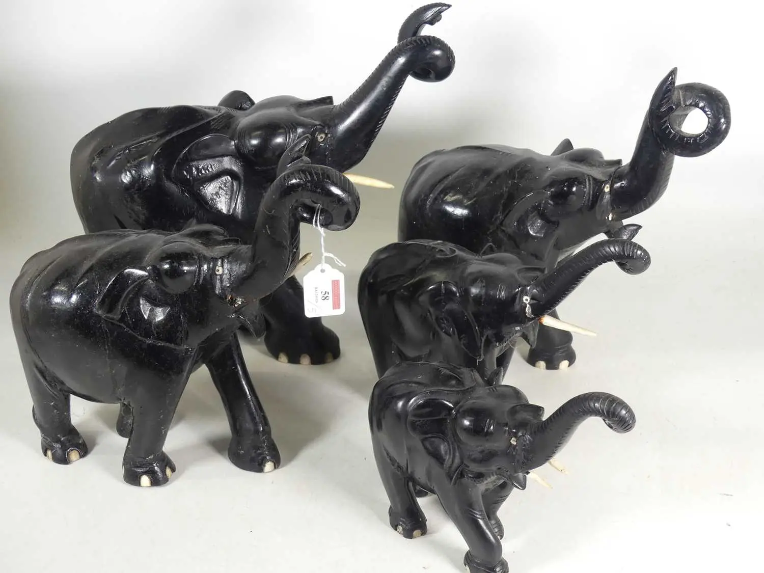 Lot 58 - A group of five carved hardwood models of