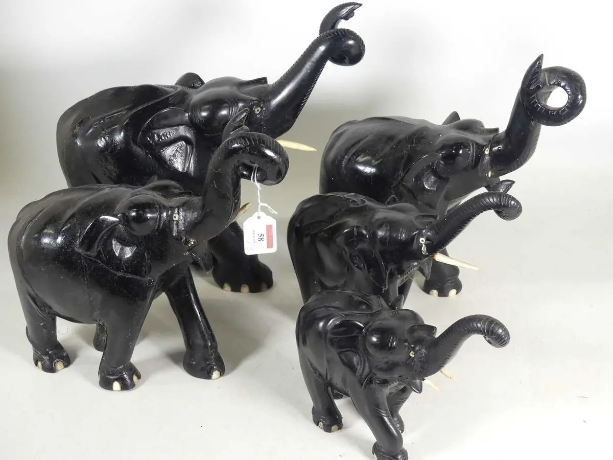 Lot 58 - A group of five carved hardwood models of