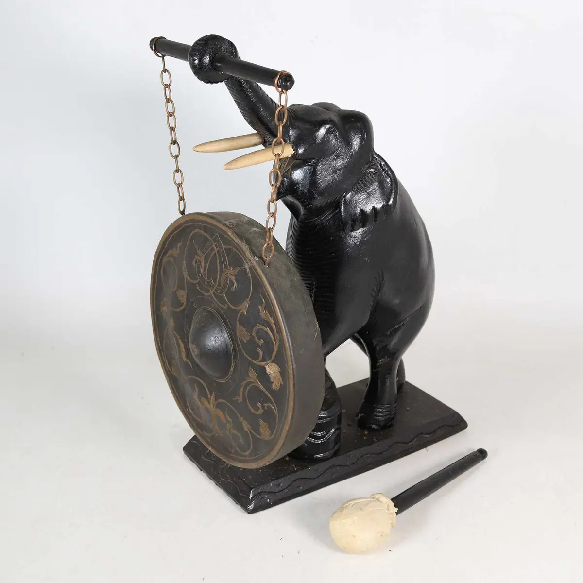 Lot 5 - A table-top gong, 20th century, the support in