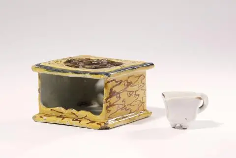 A Dutch Delft miniature marbled faience rechaud