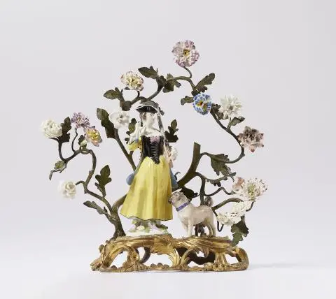 Meissen porcelain figure of a huntress and a pug dog in ormolu mounts