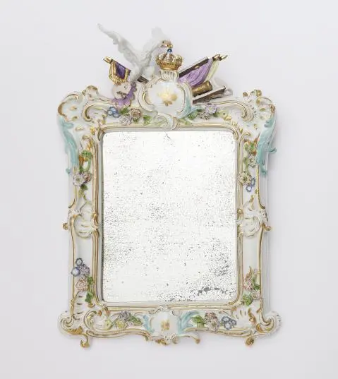 A rare Meissen porcelain frame with a vacant heraldic cartouche