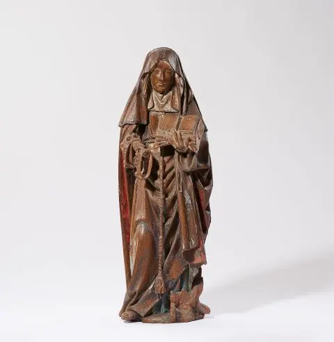 A carved oak figure of Elisabeth of Hungary
