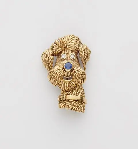 A 14k gold diamond and sapphire poodle Novelty brooch.