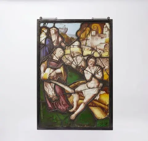 A stained glass panel depicting the story of Job