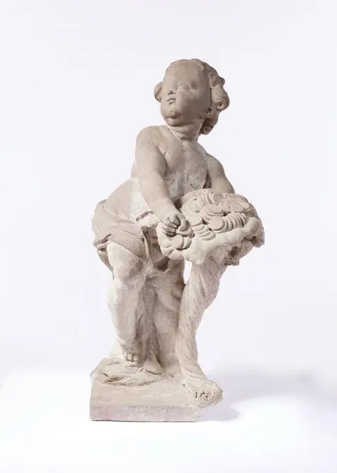 A Dresden sandstone sculpture of Putto as the embodiment of Abundantia