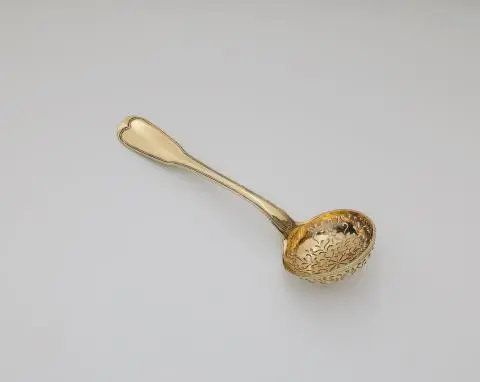 A Strasbourg silver gilt sifter spoon