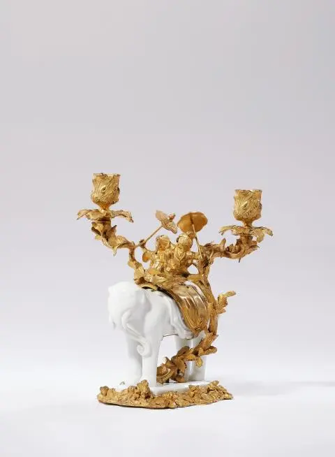 An important ormolu candlestick with children and an elephant