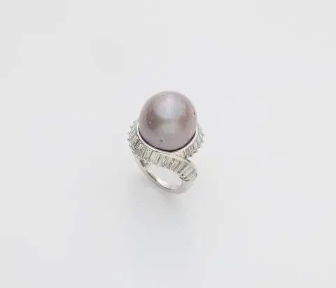 An 18k white gold, baguette-cut diamond and large brownish-greyish