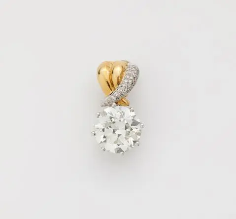 An 18k bicolour gold pendant using a 7.43 ct transition-cut diamond
