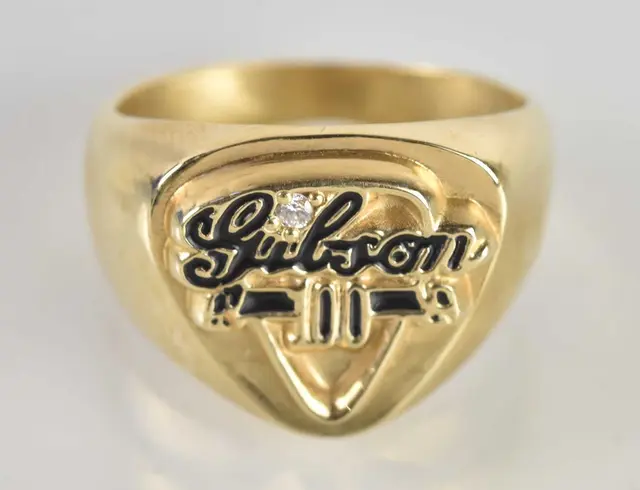 GIBSON; a 14ct yellow gold diamond set signet ring