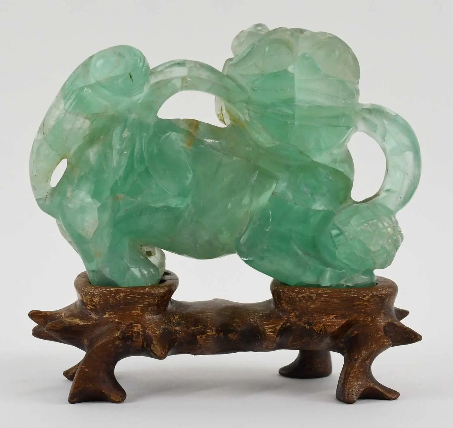 A Chinese green crystal glass carved figure of Dog of Fo