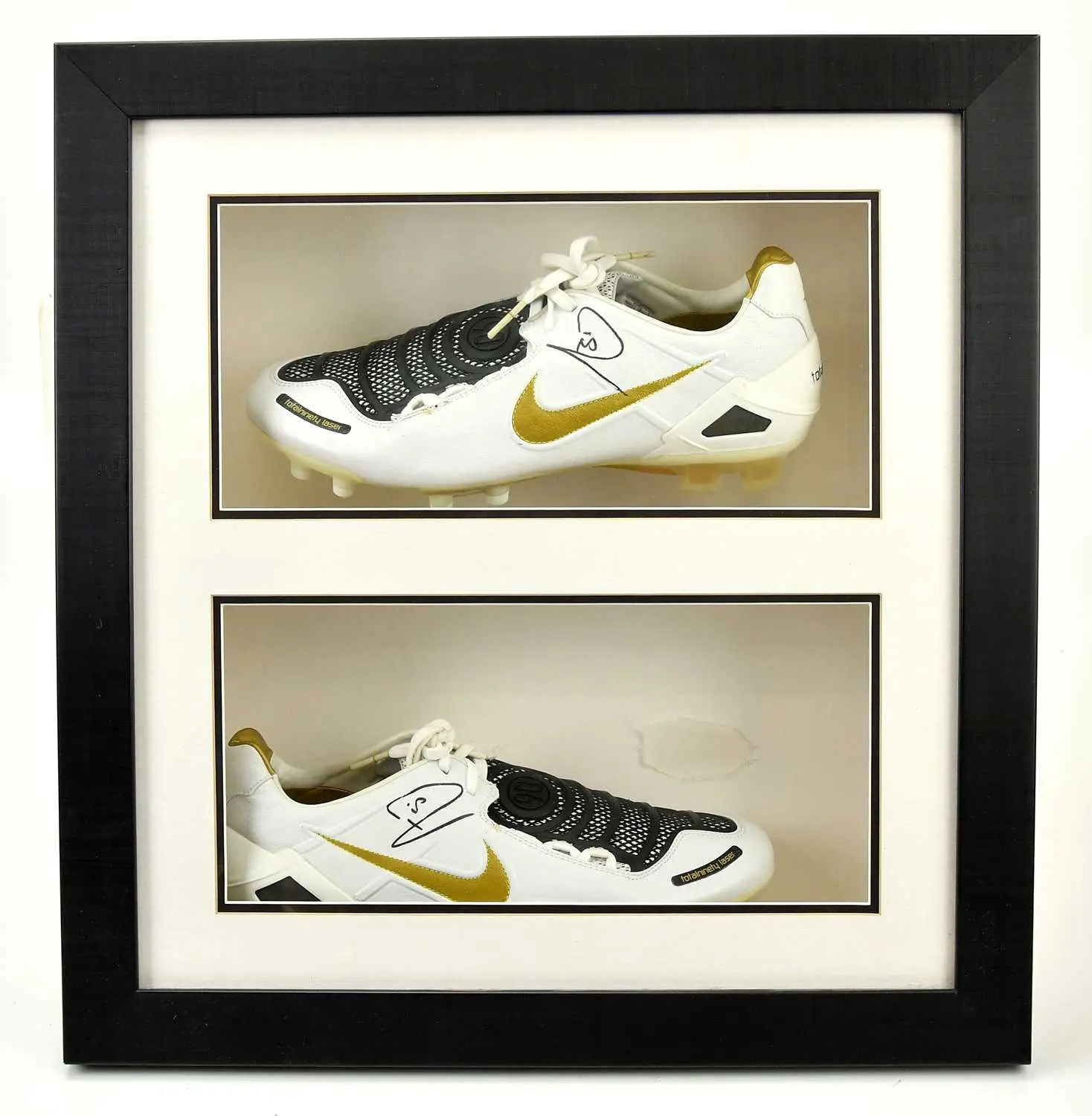 RIO FERDINAND; a framed pair of autographed Nike Total 90 football boots