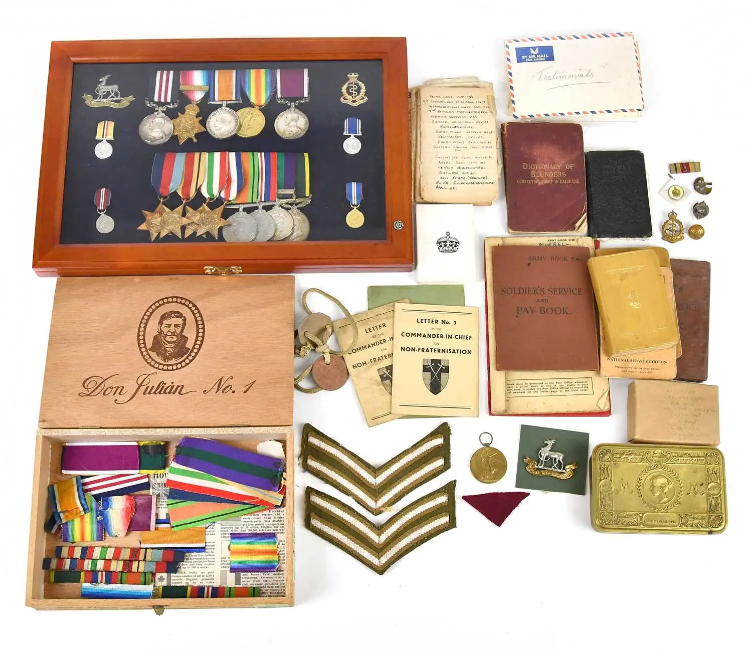 A WWI Christmas tin containing card and photograph