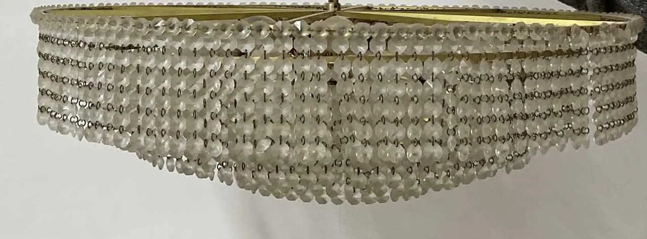 A mid 20th century multi tiered brass and crystal crown...
