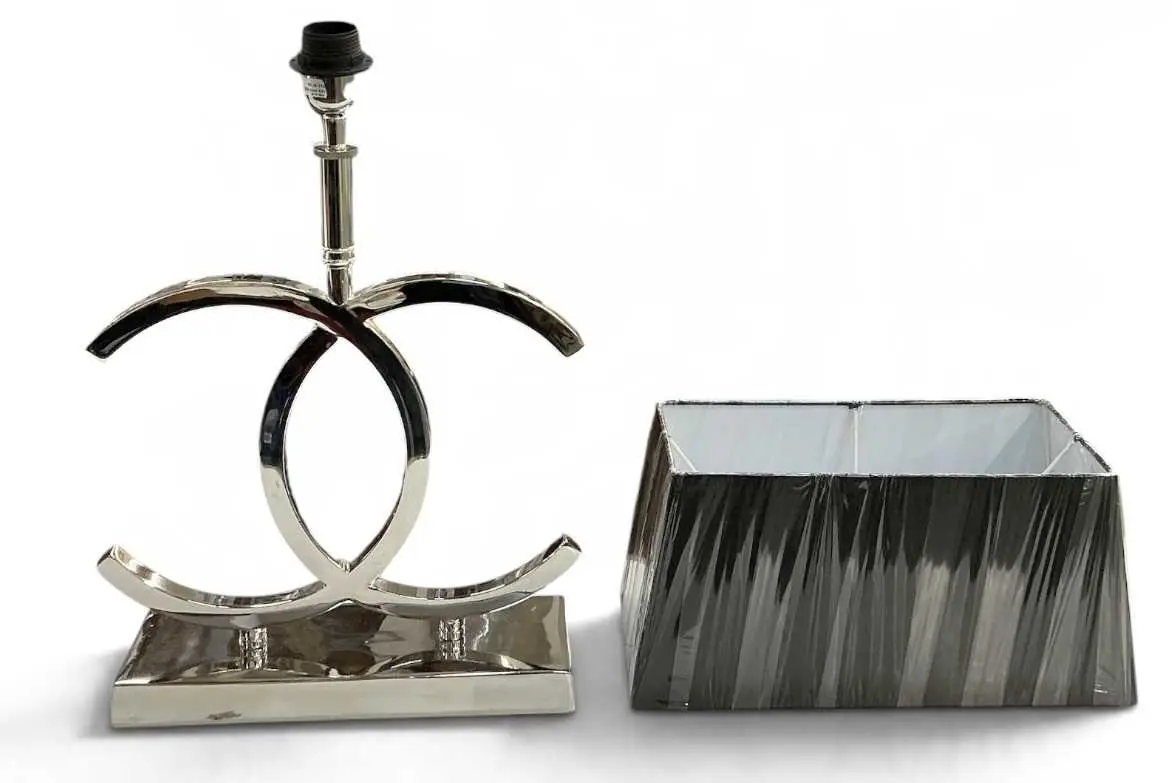 IN THE MANNER OF CHANEL; a modern contemporary chrome table lamp