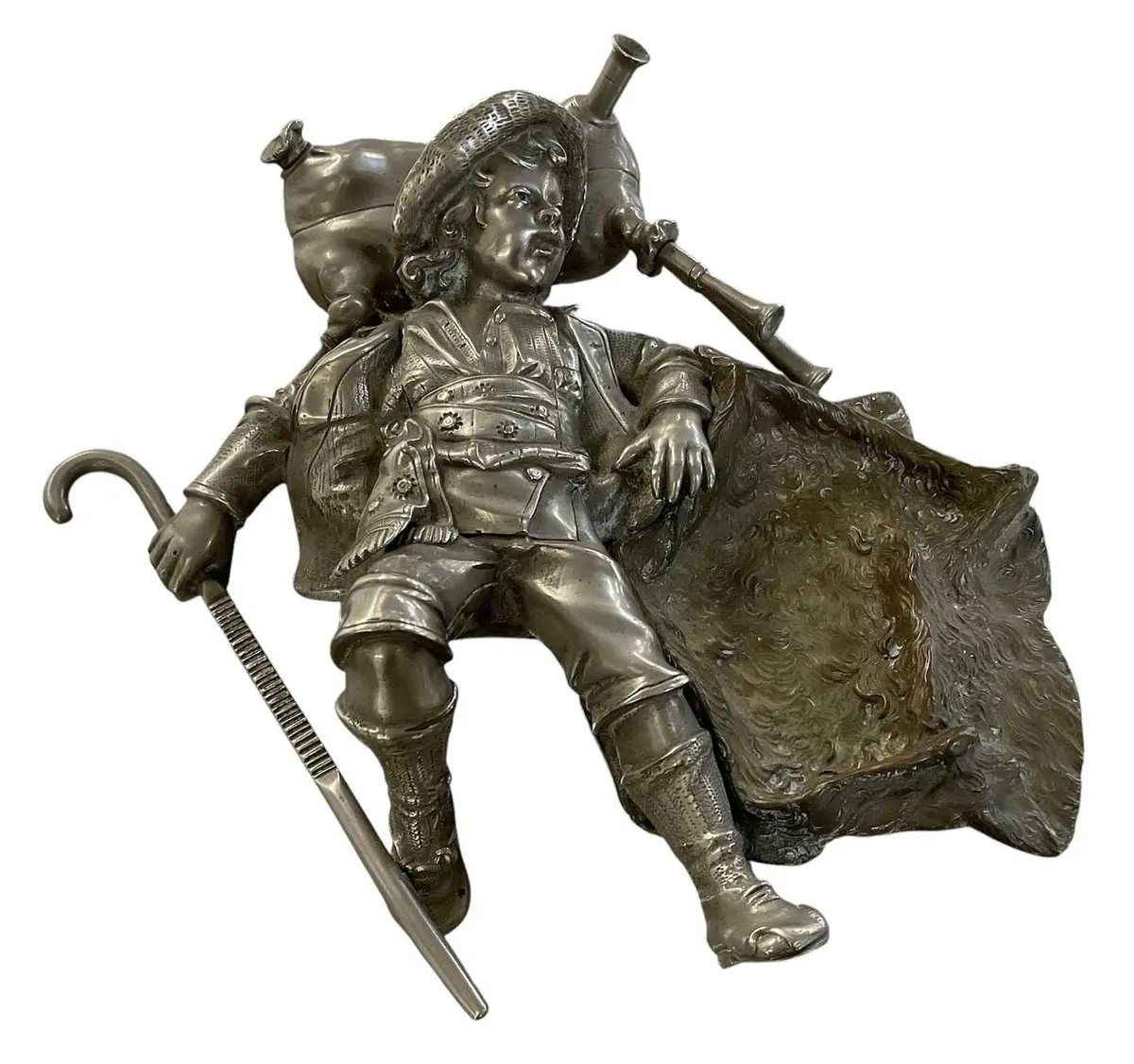 An early 20th century pewter and patinated bronze tabletop vesta companion