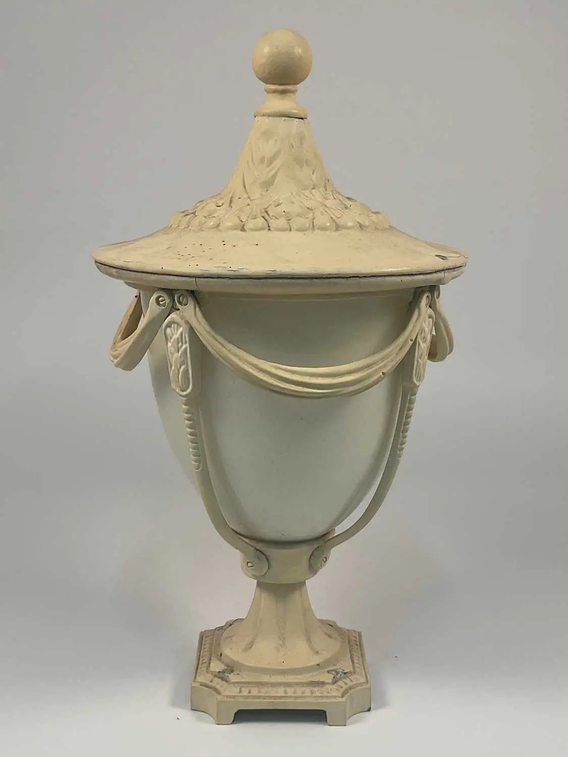 A neoclassical exterior light in the form of an urn with...