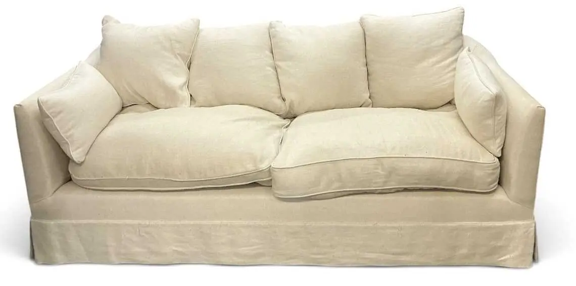A large modern contemporary white upholstered two seater sofa