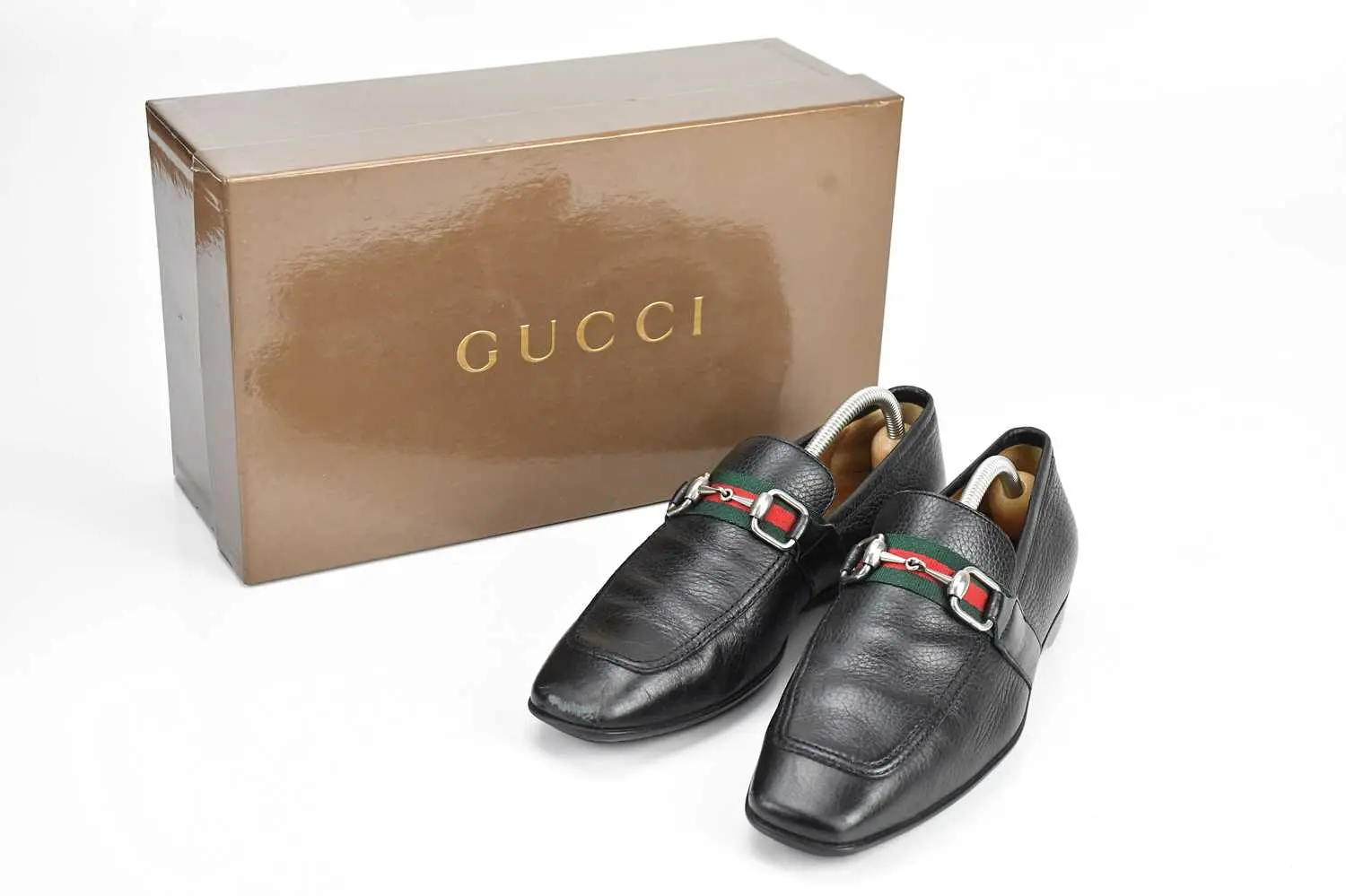 GUCCI; a pair of men's black grained calfskin leather...