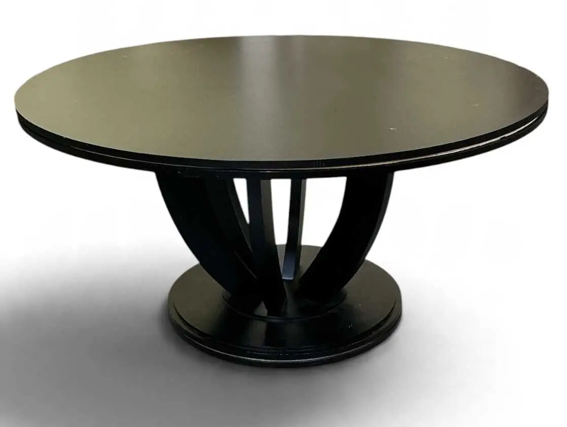 A large modern contemporary circular topped ebonised dining table