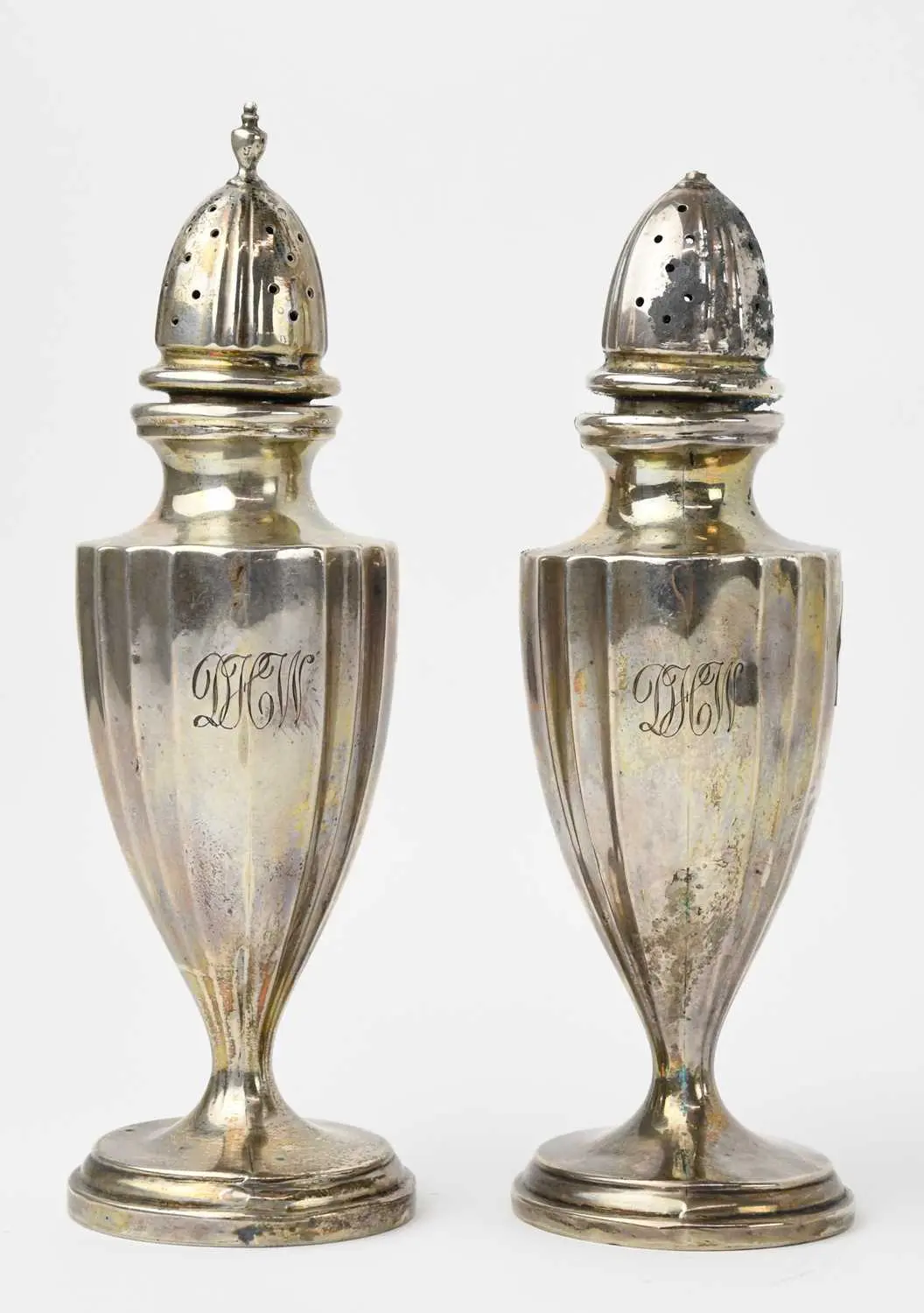 A pair of early 20th century sterling silver salt and pepper shakers