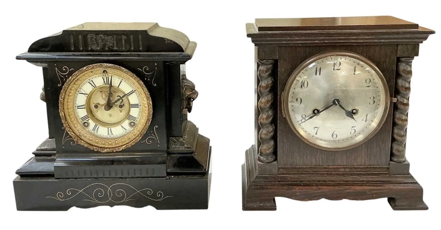 A Victorian black slate mantel clock