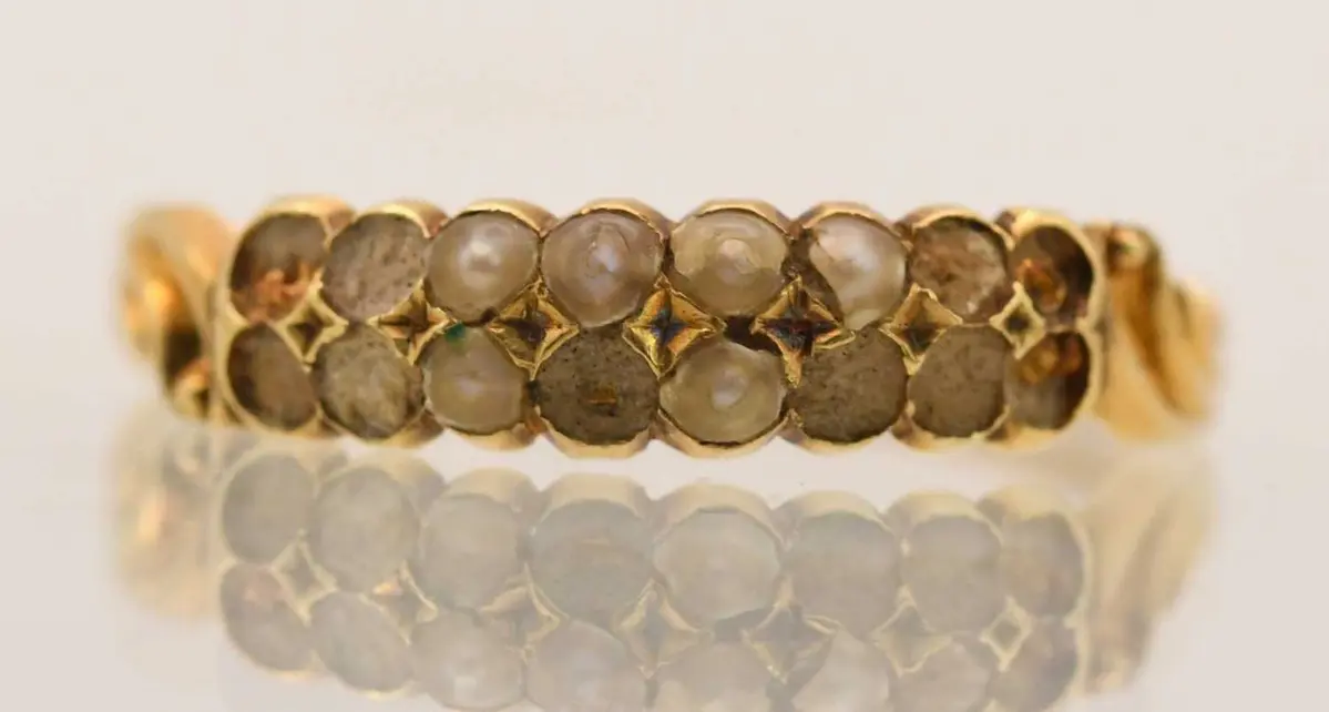A 9ct yellow gold seed pearl set dress ring