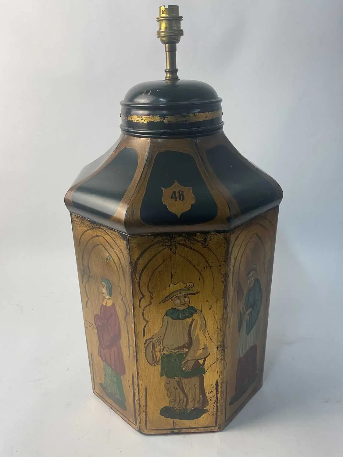 A reproduction octagonal tea caddy with three hand...