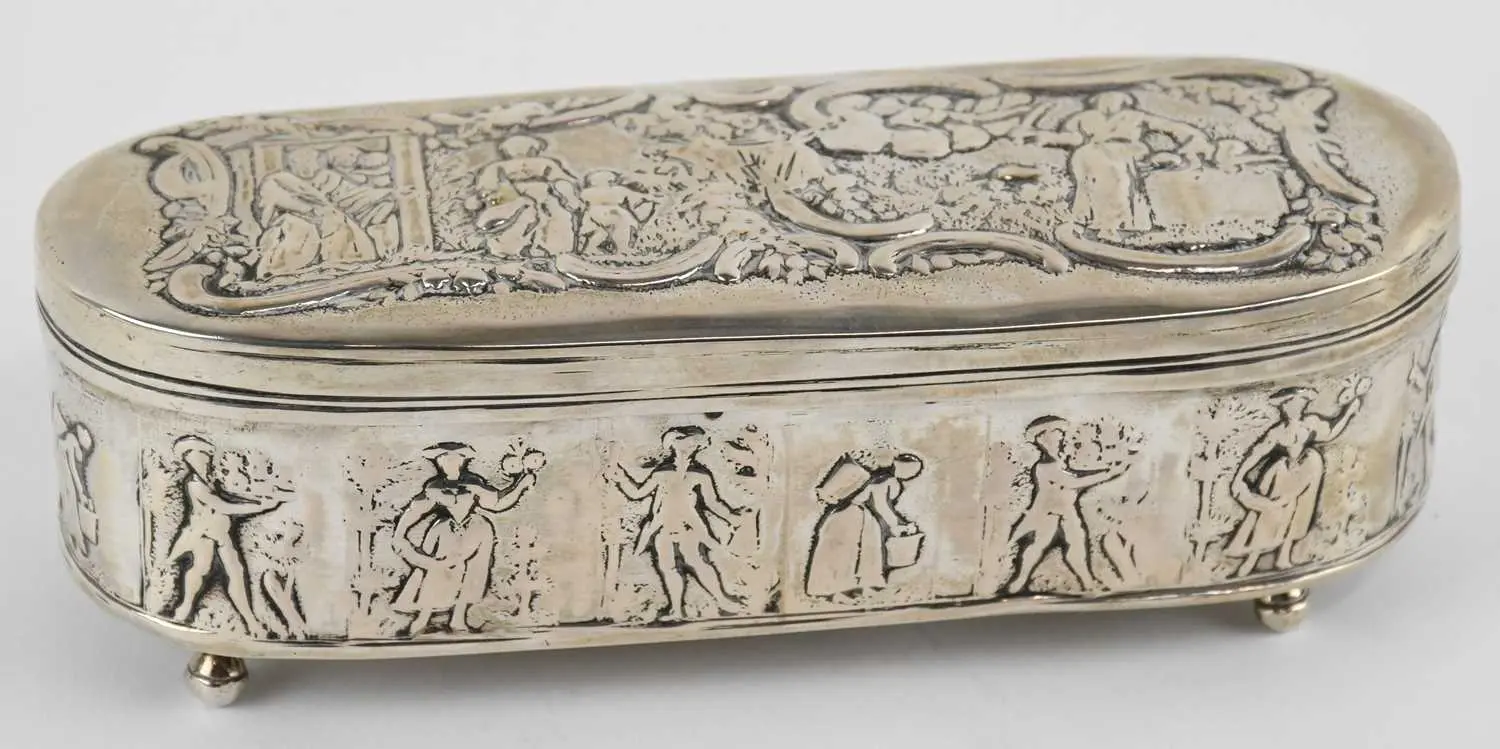 A late 19th/early 20th century Continental white metal oval lidded trinket box