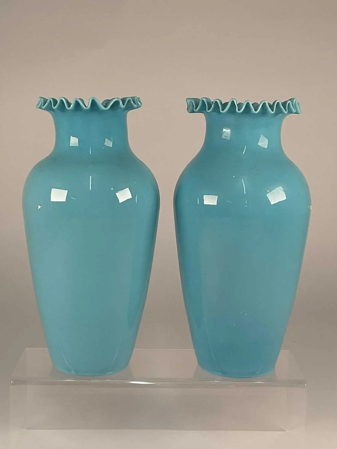 A pair of 19th century blue opaline glass vases with ruffled rim