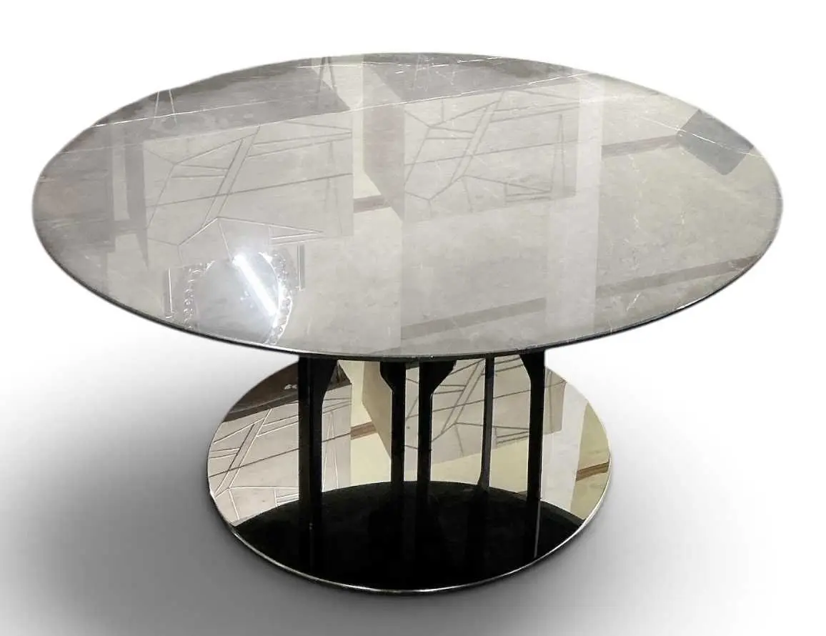 ROCHE BOBOIS; a modern contemporary circular grey marble...