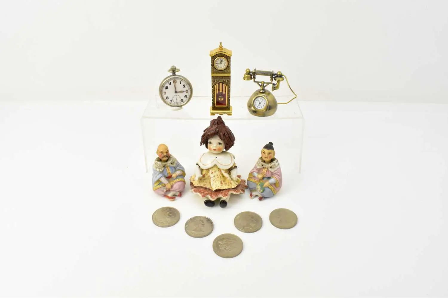 A group of various collectibles comprising a silver...