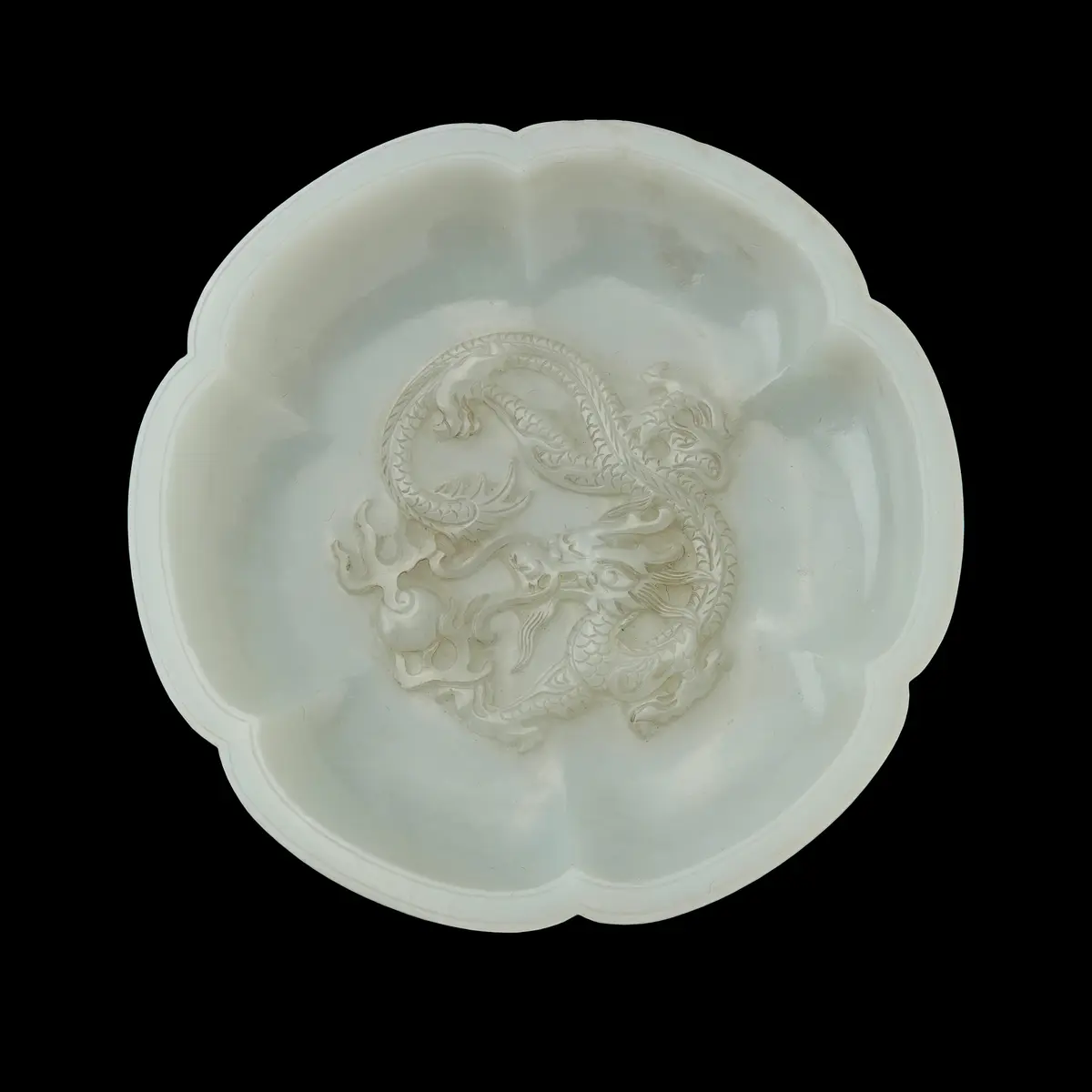 CHINESE WHITE JADE 'DRAGON' FOLIATE SAUCER
