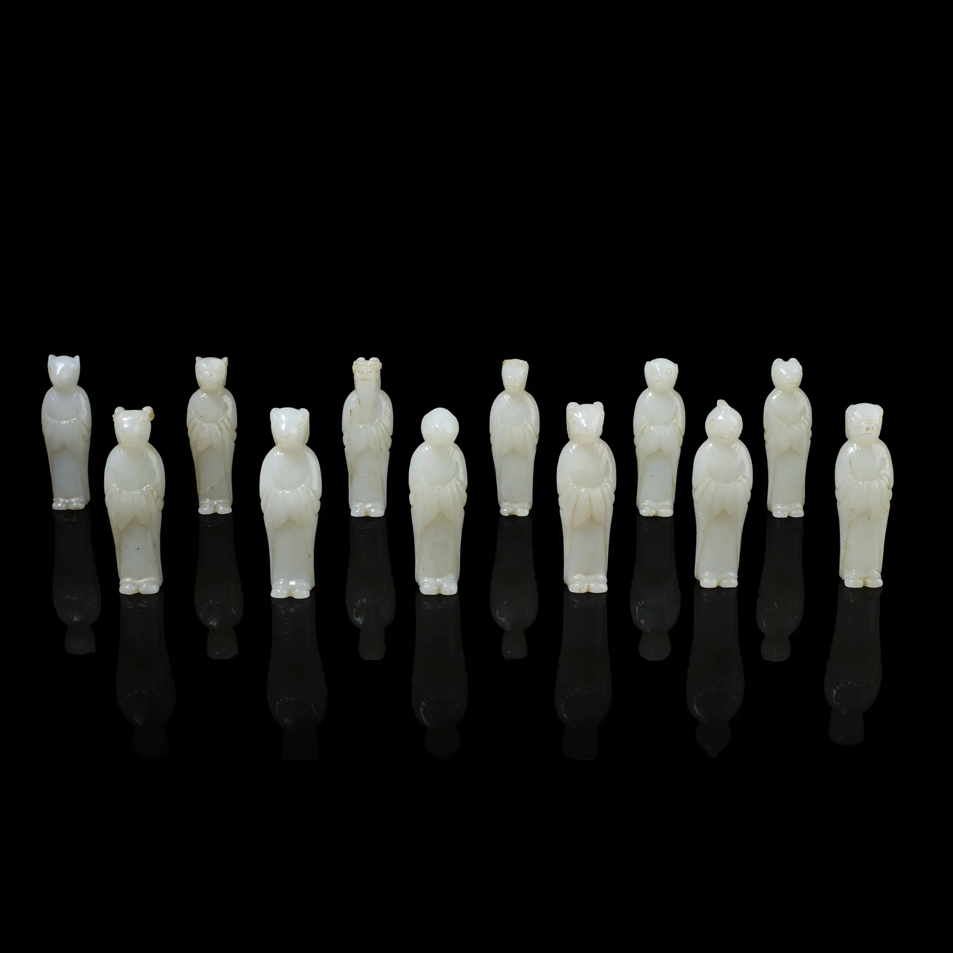 SET OF TWELVE CHINESE WHITE JADE ZODIAC CARVINGS