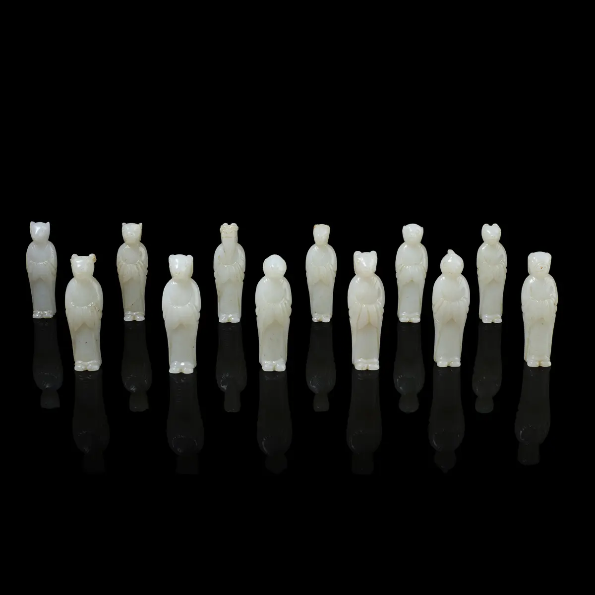 SET OF TWELVE CHINESE WHITE JADE ZODIAC CARVINGS