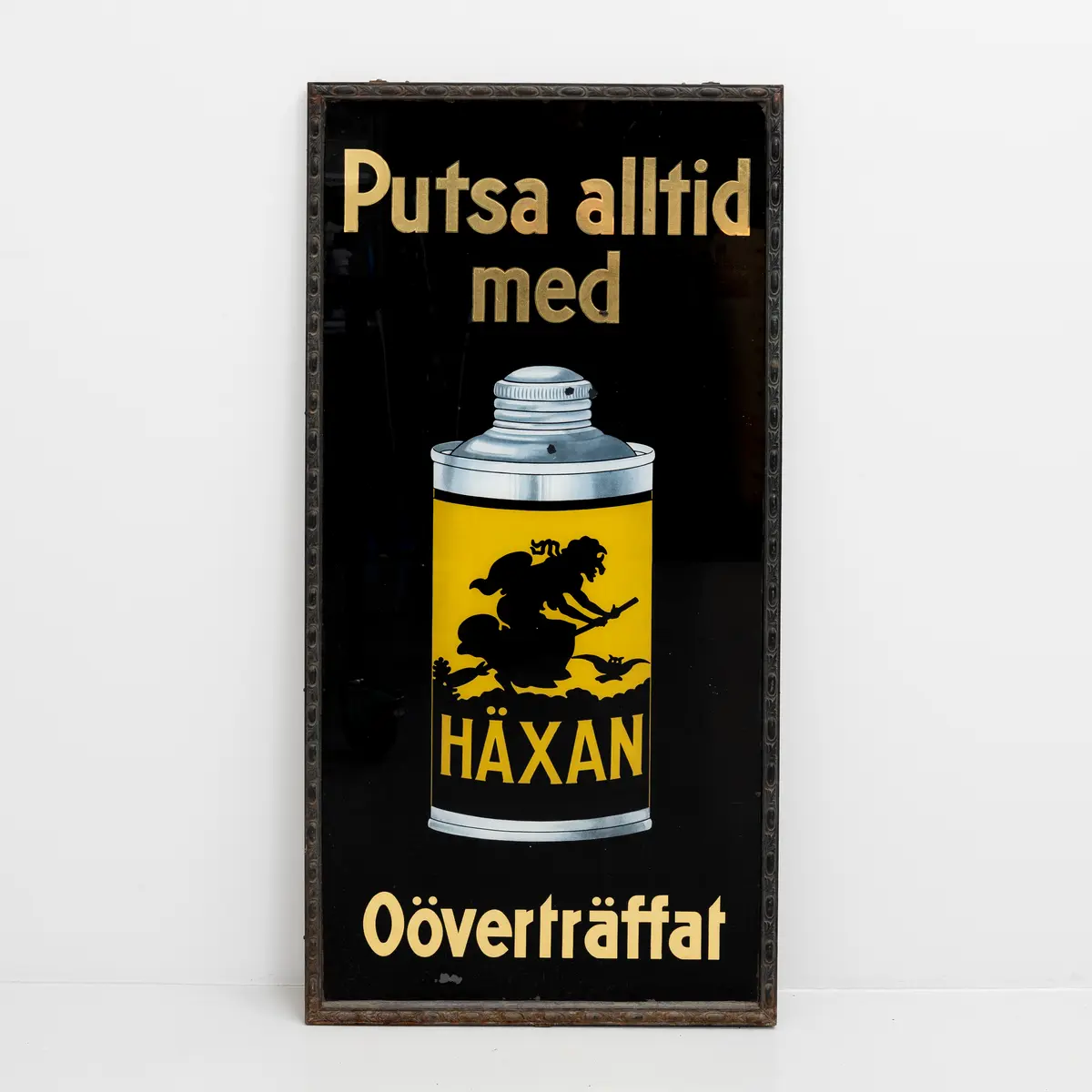 SKYLT, Häxan, litografiskt tryck på glas, 1900-talets första hälft.