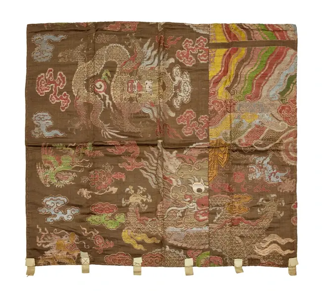 A Chinese brown silk 'dragon' brocade
