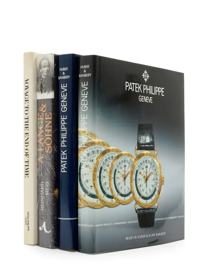 A group of 4 watch books