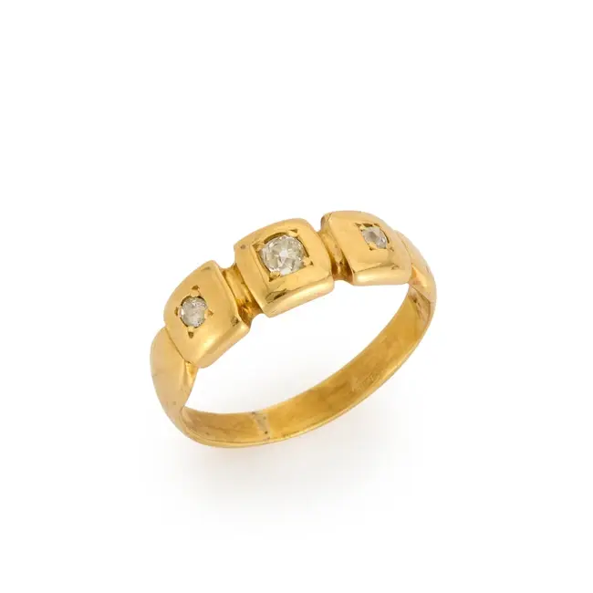 A late Victorian 18ct gold diamond three stone ring