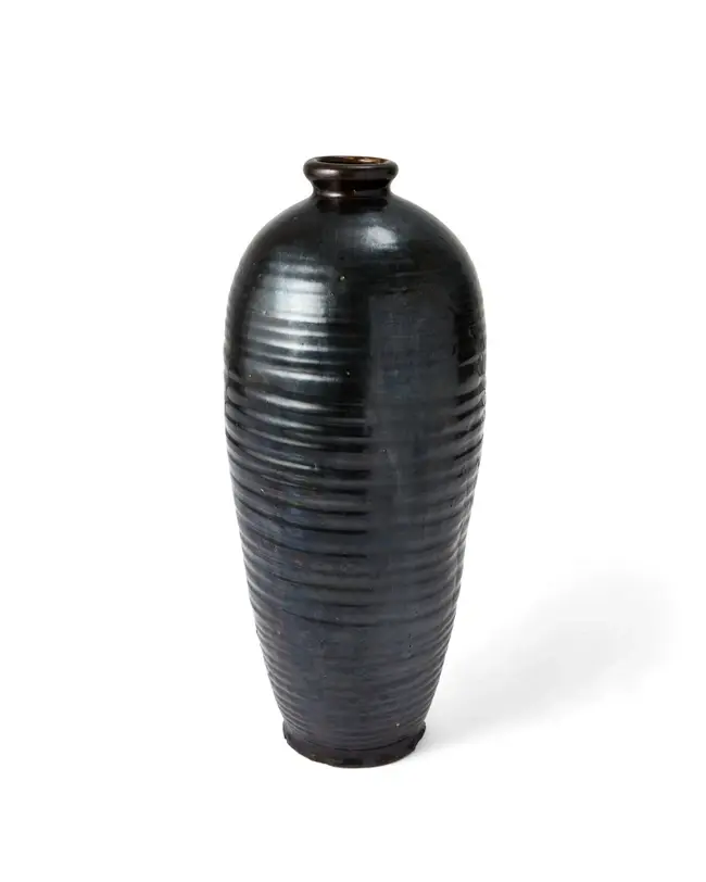 A large Chinese ribbed black glazed baluster vase