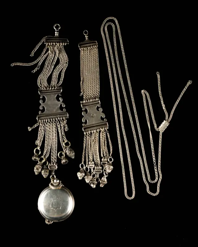 A silver cased pocket watch and attachment chain