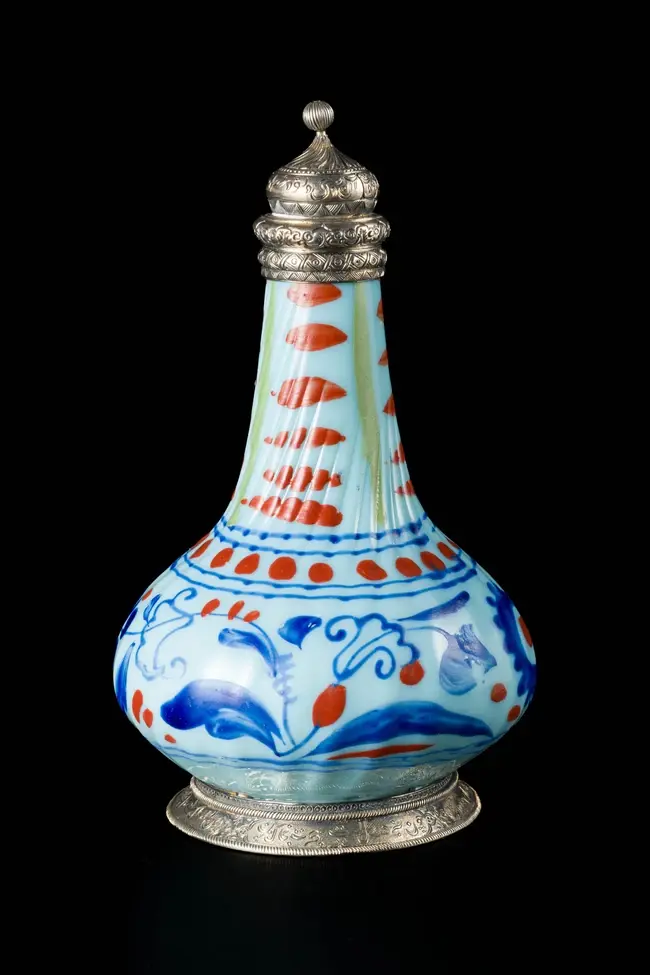 An unusual squat pyriform glass sprinkler with later inscribed silver fittings
