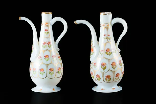 A pair of pyriform Beykoz opaline glass ewers